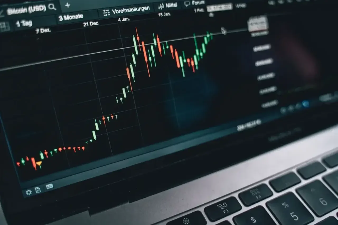 Close-up of a computer screen displaying cryptocurrency market trends and data.