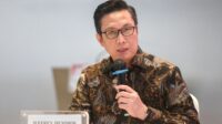 Papan layar elektronik Bursa Efek Indonesia di Jakarta yang menampilkan data pergerakan indeks saham
